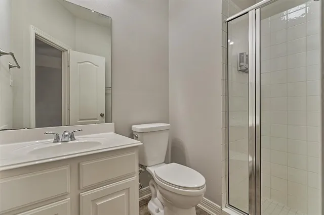 a bathroom with a bathtub sink vanity and mirror