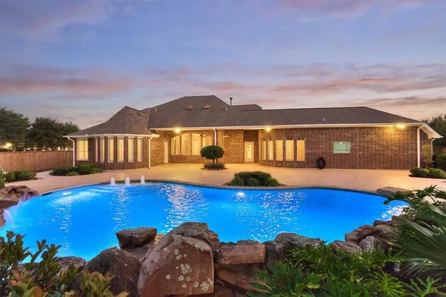 a view of pool with outdoor seating