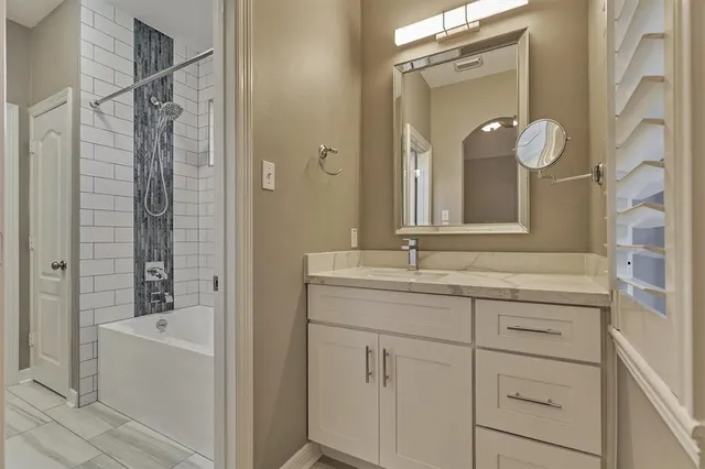 a bedroom with a bed and a potted plant