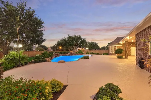 a view of a park with large trees