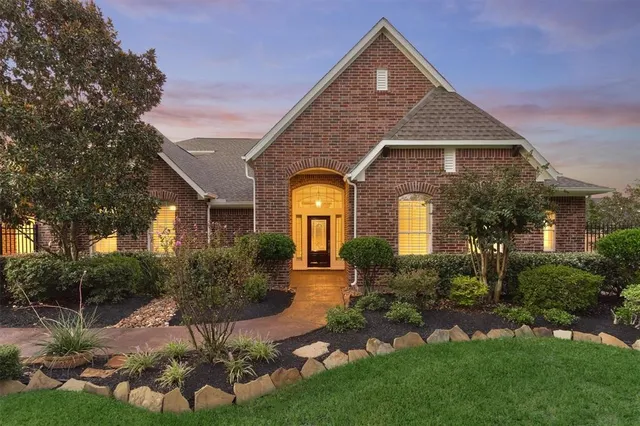 an aerial view of a house with yard
