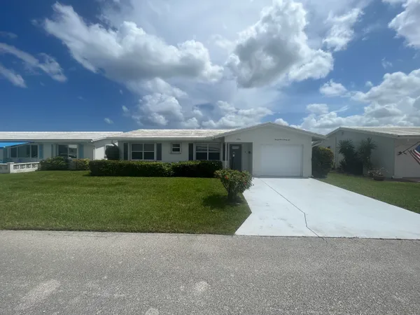 a front view of house with yard