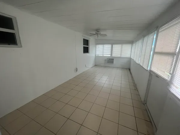 a view of empty room with windows