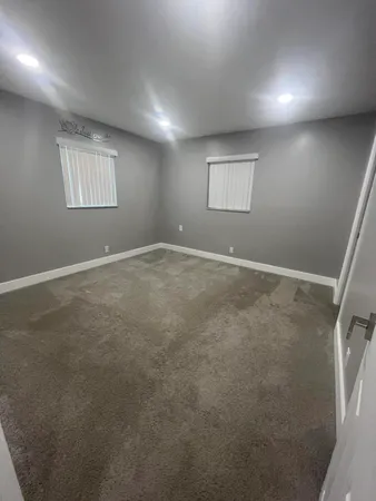 an empty room with windows and and a window