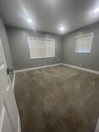 a view of an empty room with windows