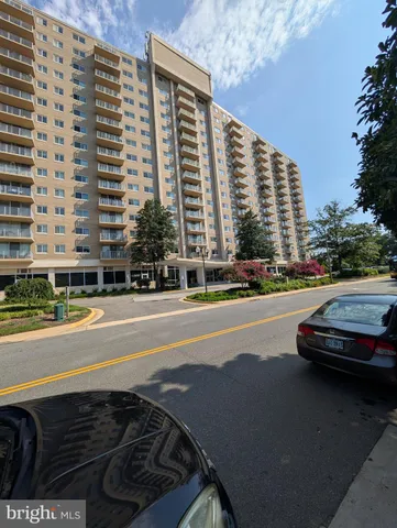 a view of street with tall buildings
