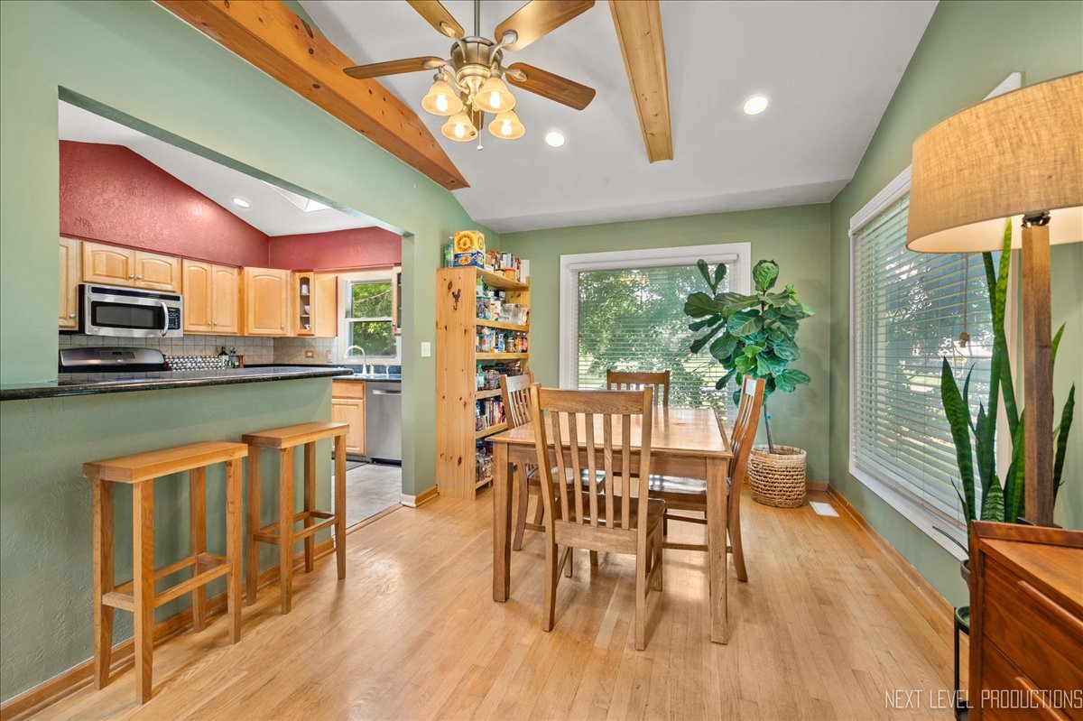 4N636 Klein Road West Chicago, IL 60185 - Photo 11 of 36 a dining room with furniture a floor to ceiling window and wooden floor