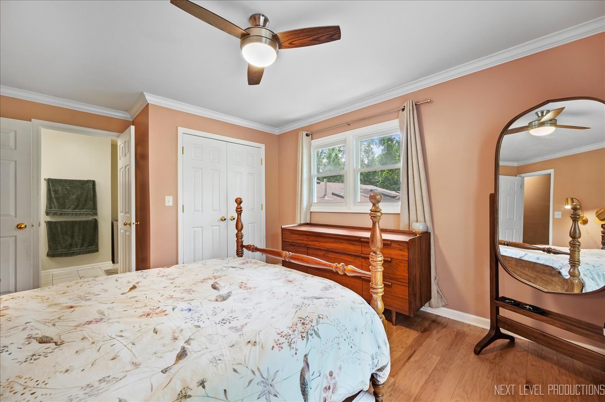 4N636 Klein Road West Chicago, IL 60185 - Photo 17 of 36 a bedroom with a bed and large windows
