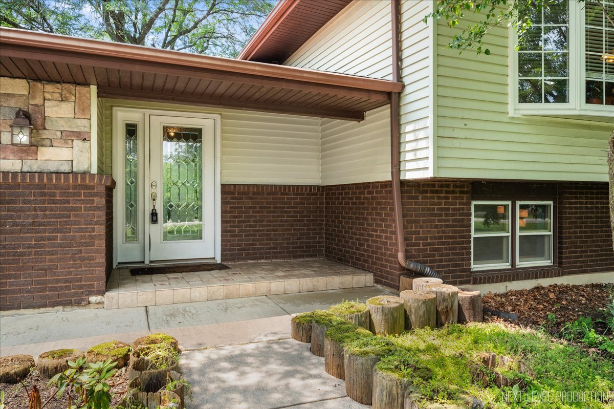 4N636 Klein Road West Chicago, IL 60185 - Photo 2 of 36 a front view of a house with garden