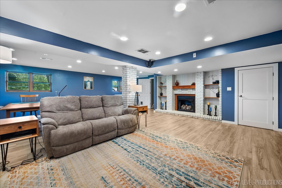 4N636 Klein Road West Chicago, IL 60185 - Photo 23 of 36 a living room with furniture and a fireplace