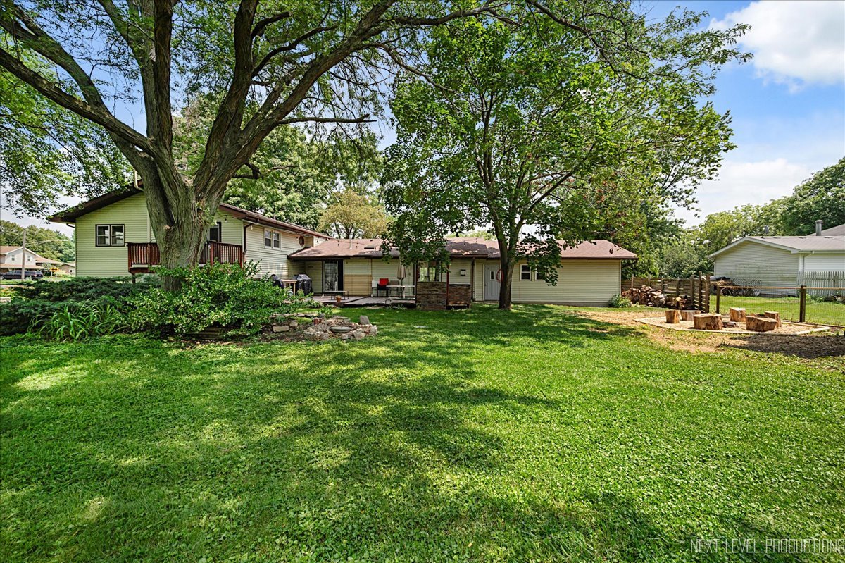 4N636 Klein Road West Chicago, IL 60185 - Photo 26 of 36 a front view of house with yard and green space
