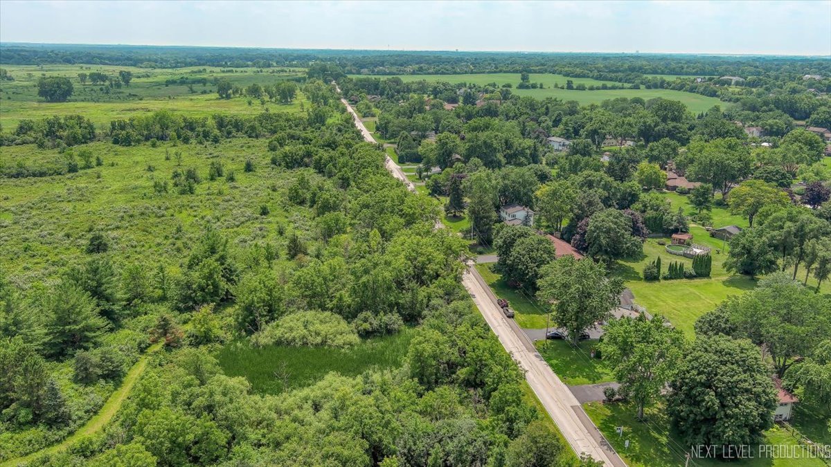 4N636 Klein Road West Chicago, IL 60185 - Photo 30 of 36 a view of a lush green forest with trees and some houses