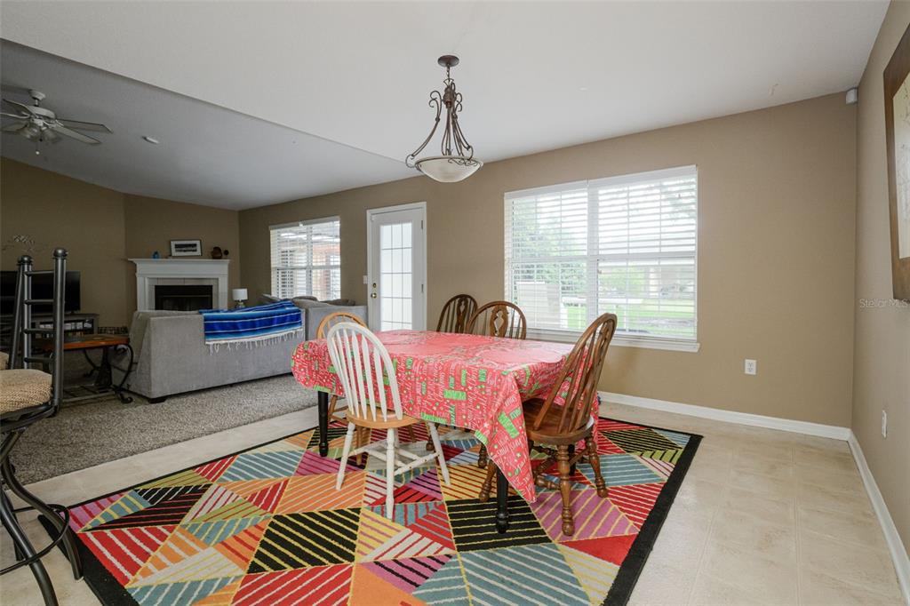11 Riddle Drive Palm Coast, FL 32164 - Photo 10 of 33 a view of a dining room with furniture window and wooden floor