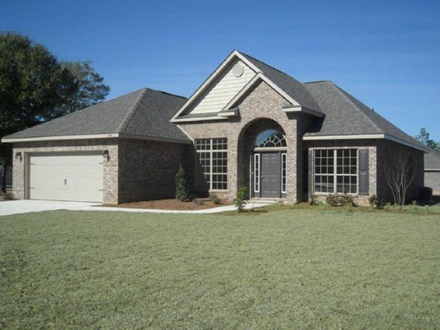 Lot 33 Maddox Santa Rosa Beach Santa Rosa Beach, FL 32459 - Photo 1 of 16 a front view of a house with a yard and garage