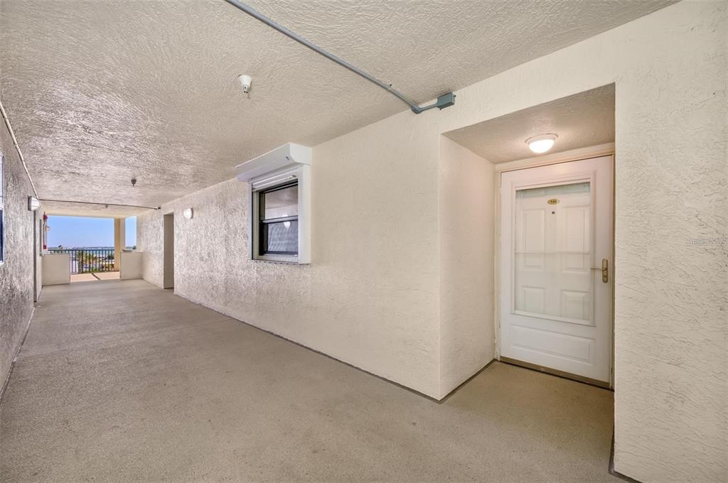 12924 Gulf Boulevard, Unit 510 Madeira Beach, FL 33708 - Photo 45 of 61 a view of a hallway