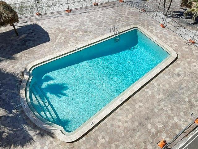 12924 Gulf Boulevard, Unit 510 Madeira Beach, FL 33708 - Photo 47 of 61 a view of swimming pool from a balcony