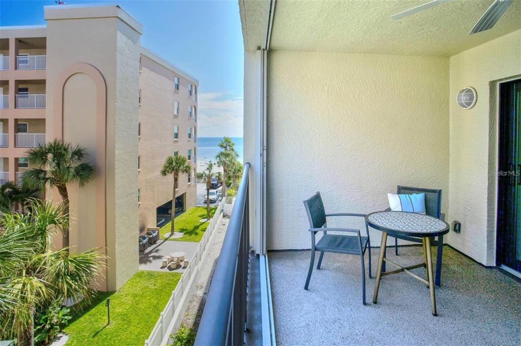 12924 Gulf Boulevard, Unit 510 Madeira Beach, FL 33708 - Photo 61 of 61 a view of a room with furniture and a potted plant