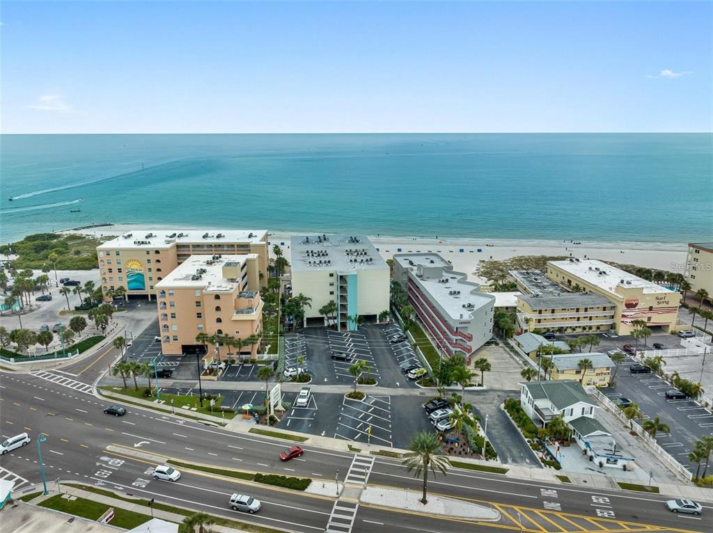 12924 Gulf Boulevard, Unit 510 Madeira Beach, FL 33708 - Photo 7 of 61 an aerial view of multiple house