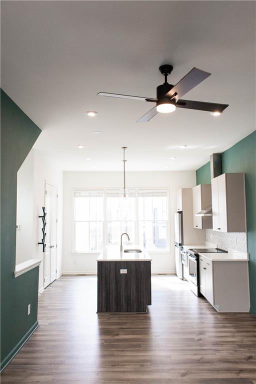 728 Perch Place Atlanta, GA 30312 - Photo 1 of 19 a large kitchen with stainless steel appliances kitchen island granite countertop a sink and a large window