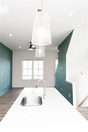 a kitchen with a sink and a window
