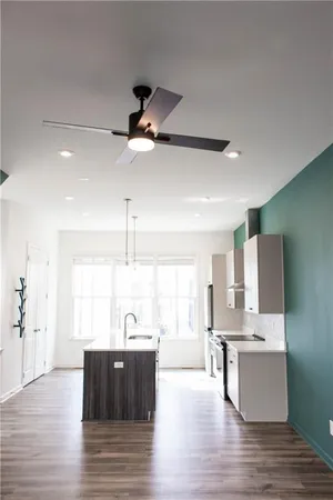 a view of kitchen with wooden floor and window