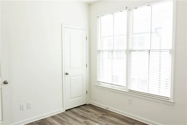 a view of a window with wooden floor
