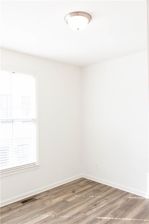 728 Perch Place Atlanta, GA 30312 - Photo 10 of 19 a view of a small space with wooden floor and a window