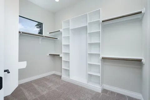 a view of an empty walk in closet