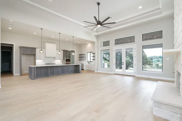 a view of a kitchen with a sink and a window