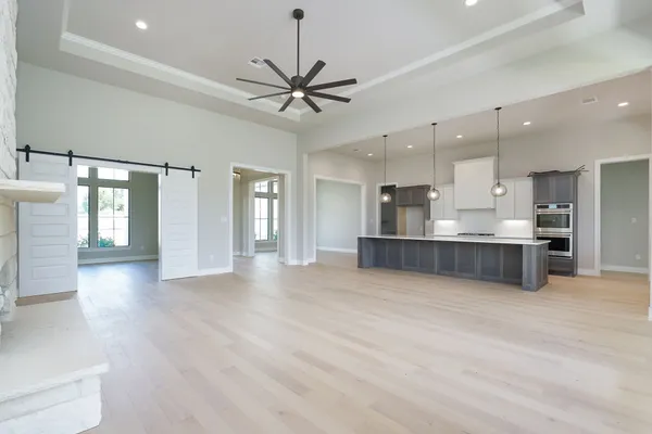 a view of a kitchen with a sink and a window