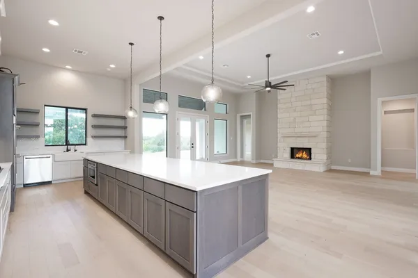 a large kitchen with a large island in it