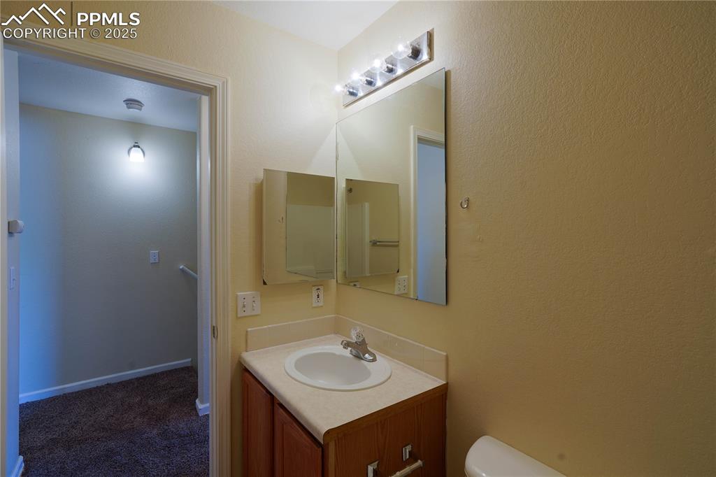 4400 Rawhide Road, Unit 157 Pueblo, CO 81008 - Photo 11 of 19 a bathroom with a sink and a mirror