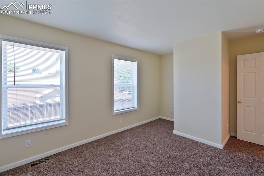 4400 Rawhide Road, Unit 157 Pueblo, CO 81008 - Photo 16 of 19 an empty room with windows and closet