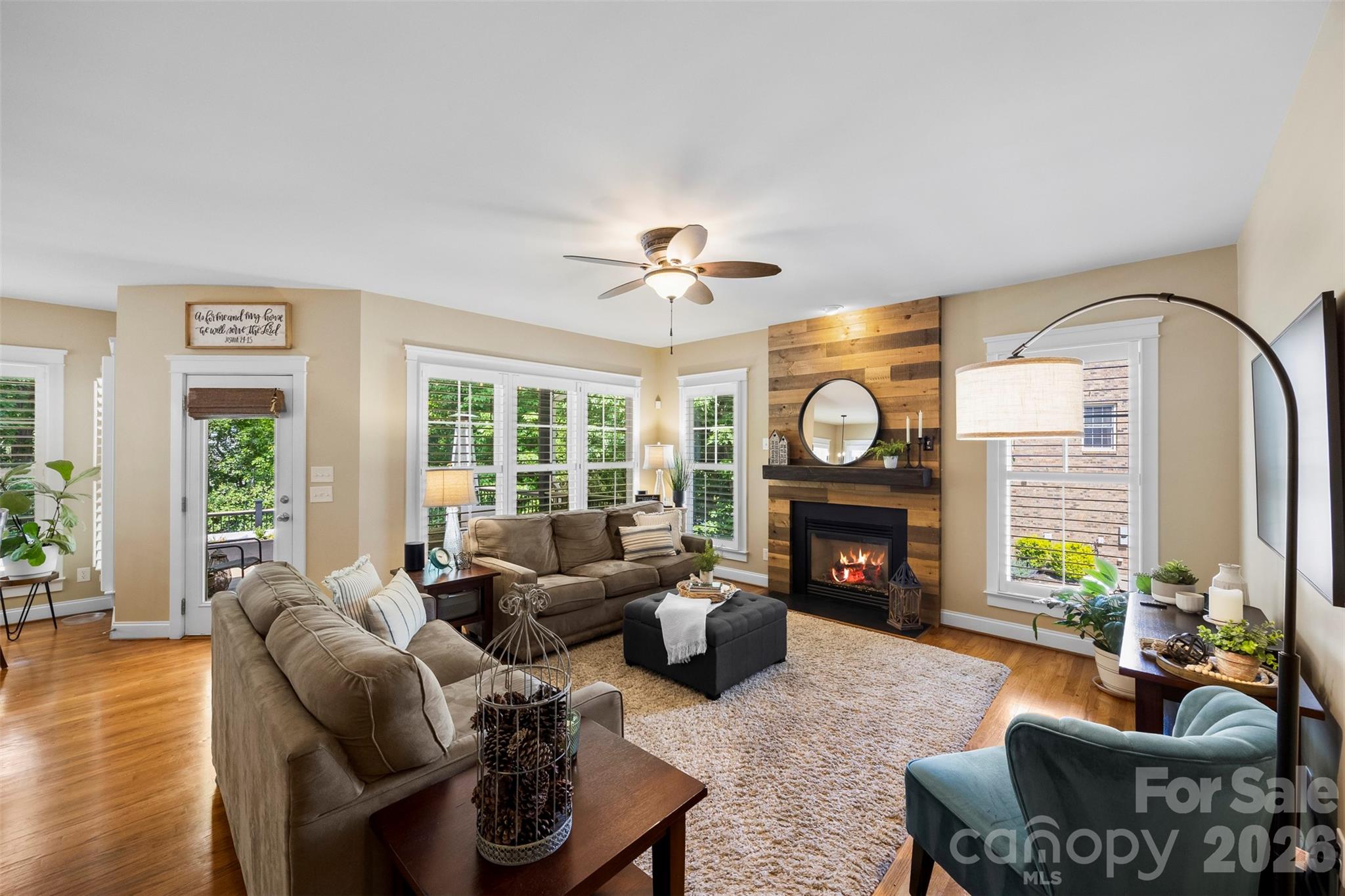 606 Andover Lane Tega Cay, SC 29708 - Photo 16 of 48 a living room with fireplace furniture and a fireplace