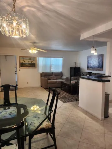a kitchen with furniture and a dining table