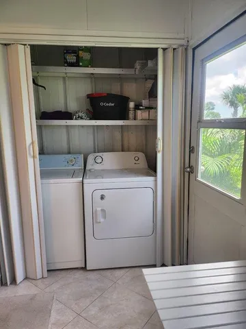 a utility room with washer and dryer