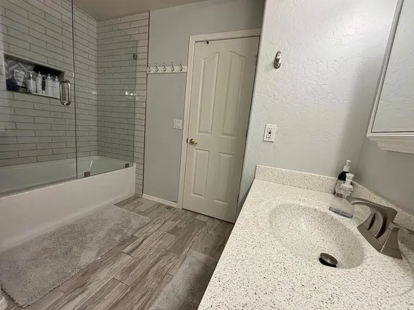 a bathroom with a sink and a tub