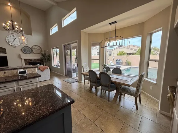a view of a dining room with furniture window and outside view