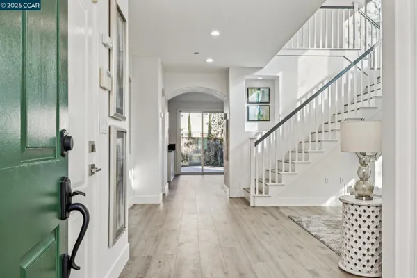 a view of entryway with wooden floor