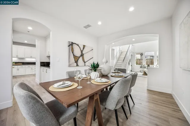 a kitchen with stainless steel appliances granite countertop a sink stove and cabinets