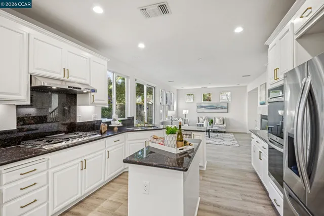 a bathroom with a tub a sink a mirror and a shower