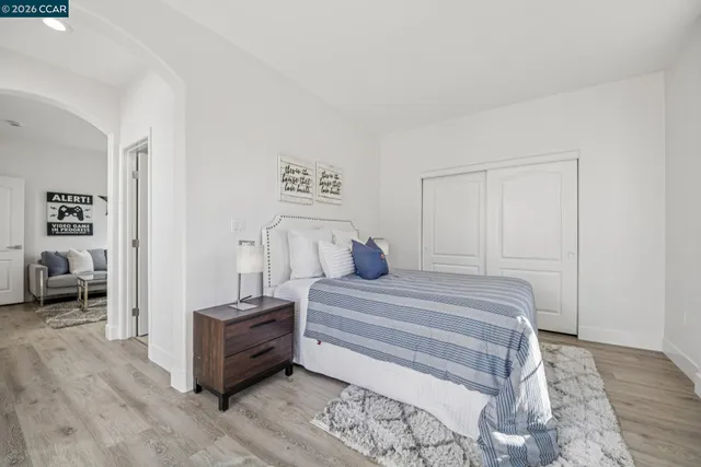 a bedroom with a bed and a table