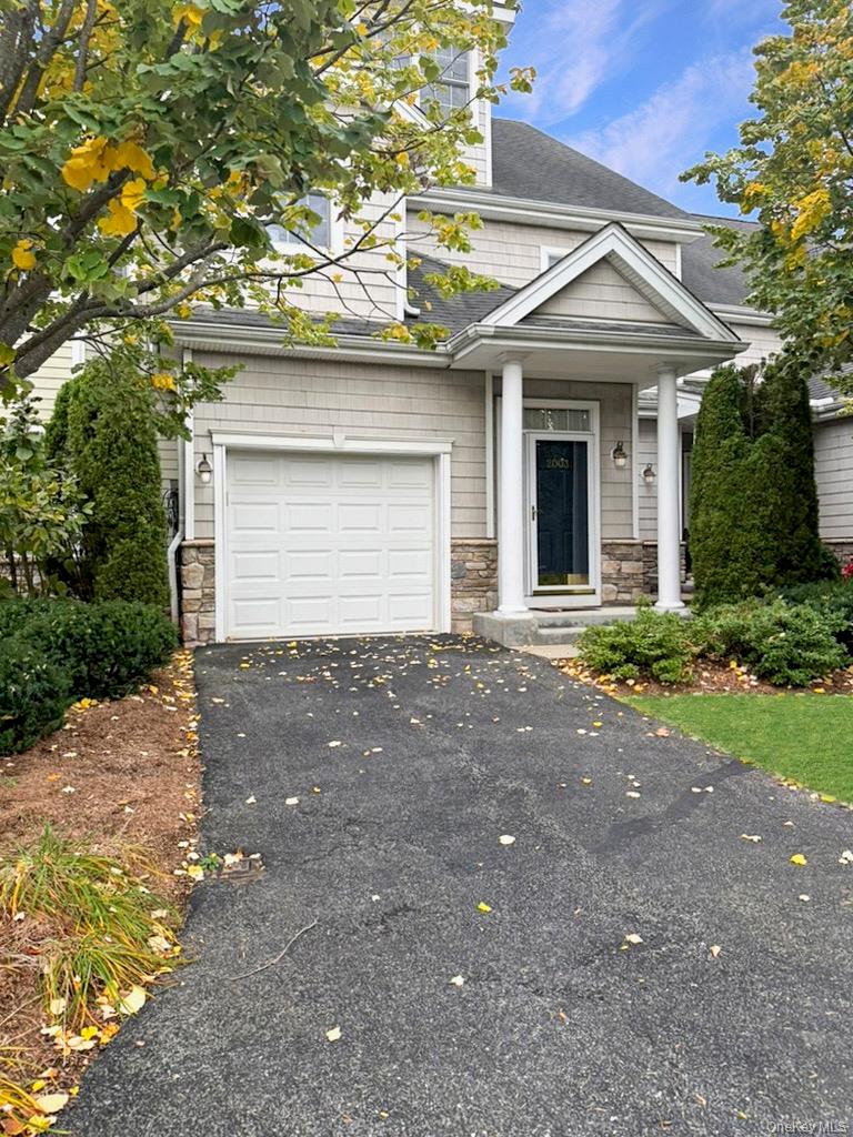 2003 Half Moon Bay Drive, Unit 2003 Croton-on-Hudson, NY 10520 - Photo 1 of 33 a front view of a house with a yard and garage