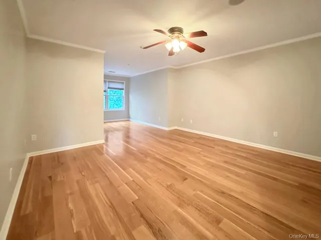 a bedroom with a bed lamp and a window