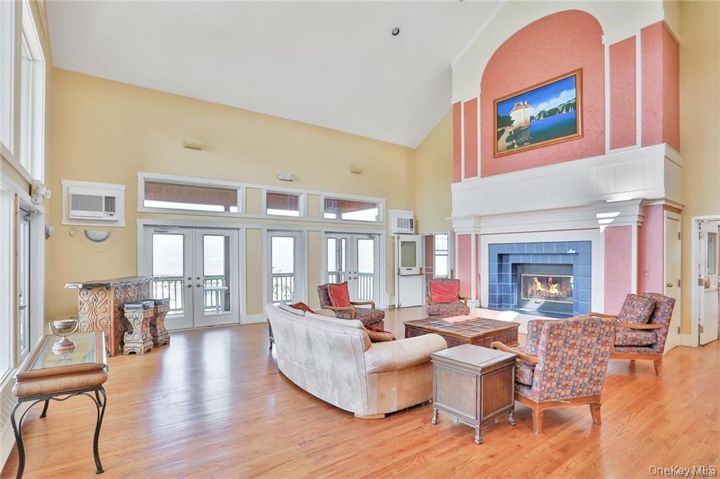 2003 Half Moon Bay Drive, Unit 2003 Croton-on-Hudson, NY 10520 - Photo 26 of 33 a living room with fireplace furniture and a fireplace