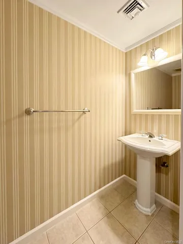 a bathroom with a sink and mirror