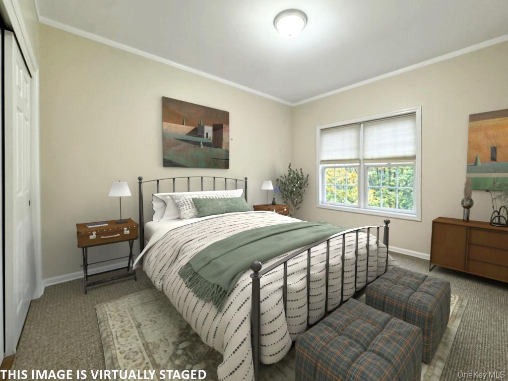 2003 Half Moon Bay Drive, Unit 2003 Croton-on-Hudson, NY 10520 - Photo 8 of 33 a bedroom with a bed and a couch