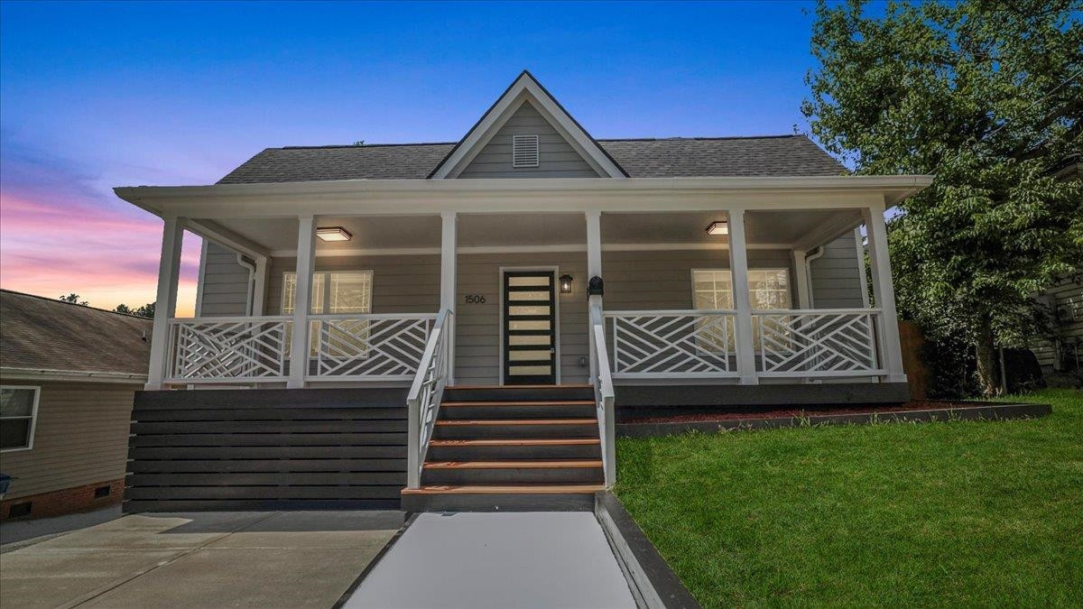 1506 Chapel Hill Road Durham, NC 27701 - Photo 1 of 50 a front view of a house with garden