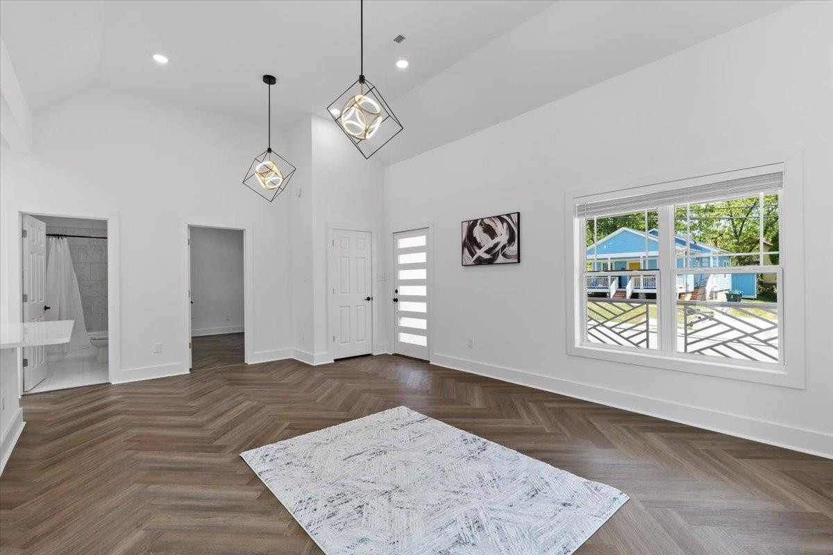 1506 Chapel Hill Road Durham, NC 27701 - Photo 12 of 50 an empty room with wooden floor and windows