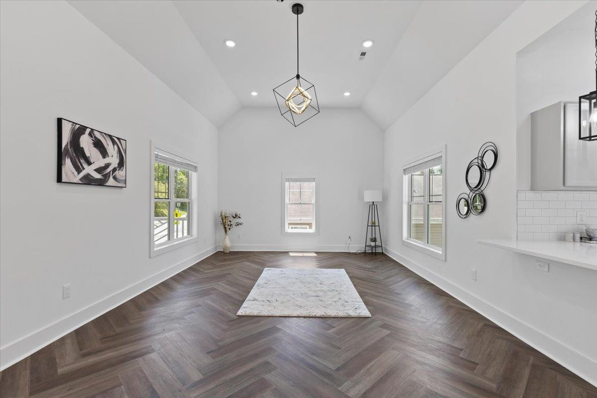1506 Chapel Hill Road Durham, NC 27701 - Photo 13 of 50 a view of an empty room with window and wooden floor